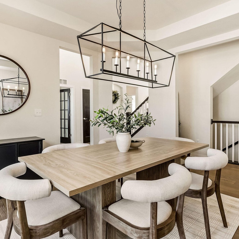 Designer reviewing furniture, finishes, and layout plans with homeowner in living room in wisconsin