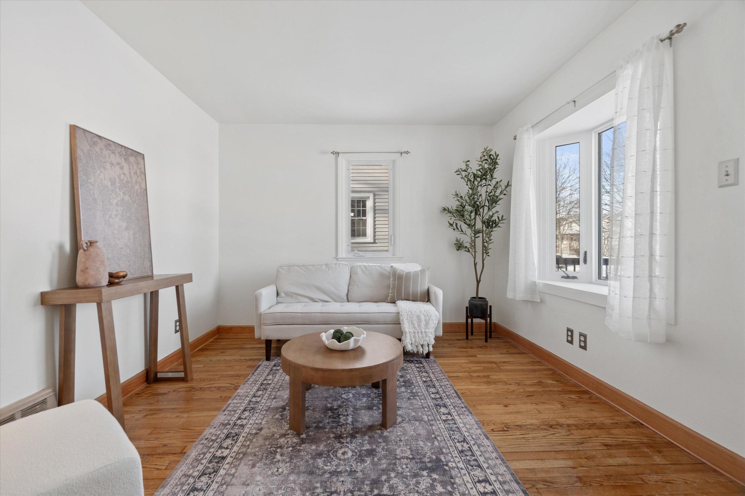 Bright and polished living room styled for Home Staging in Hartland, WI